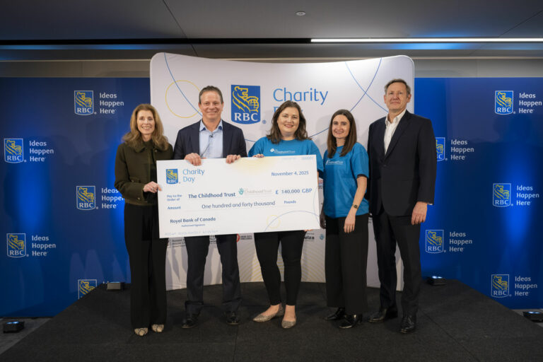 The Childhood Trust and RBC staff holding a big cheque
