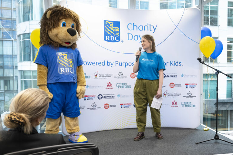 The Childhood Trust staff standing next to the RBC mascot
